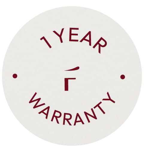 Circular badge with maroon text reading "1 YEAR WARRANTY" and two dots on either side, all on a light background.